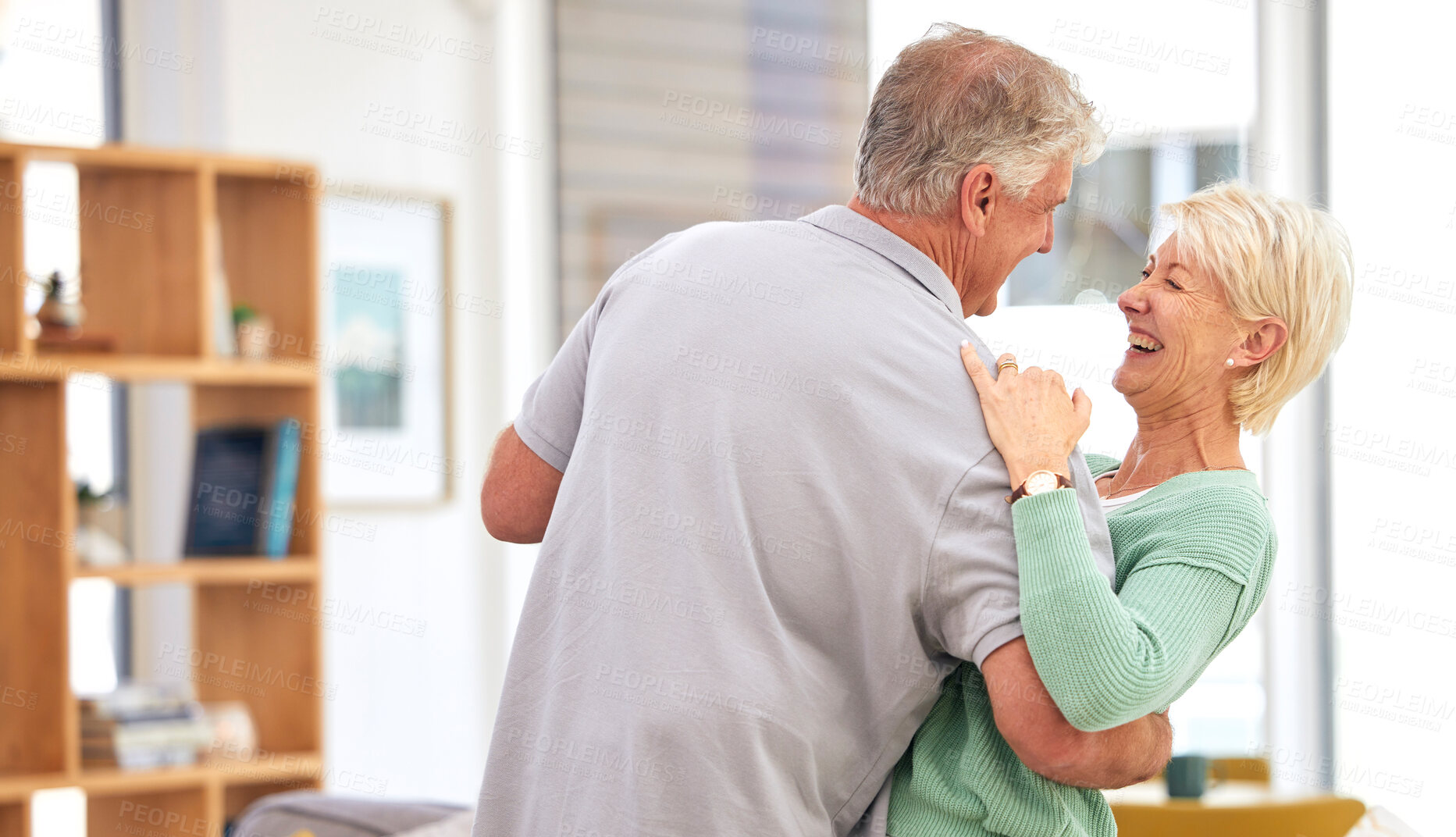 Buy stock photo Funny, dancing or happy old couple laughing with love, care or smile in marriage at home together. Hug, romantic elderly man or senior woman bonding with joy in retirement to relax in living room