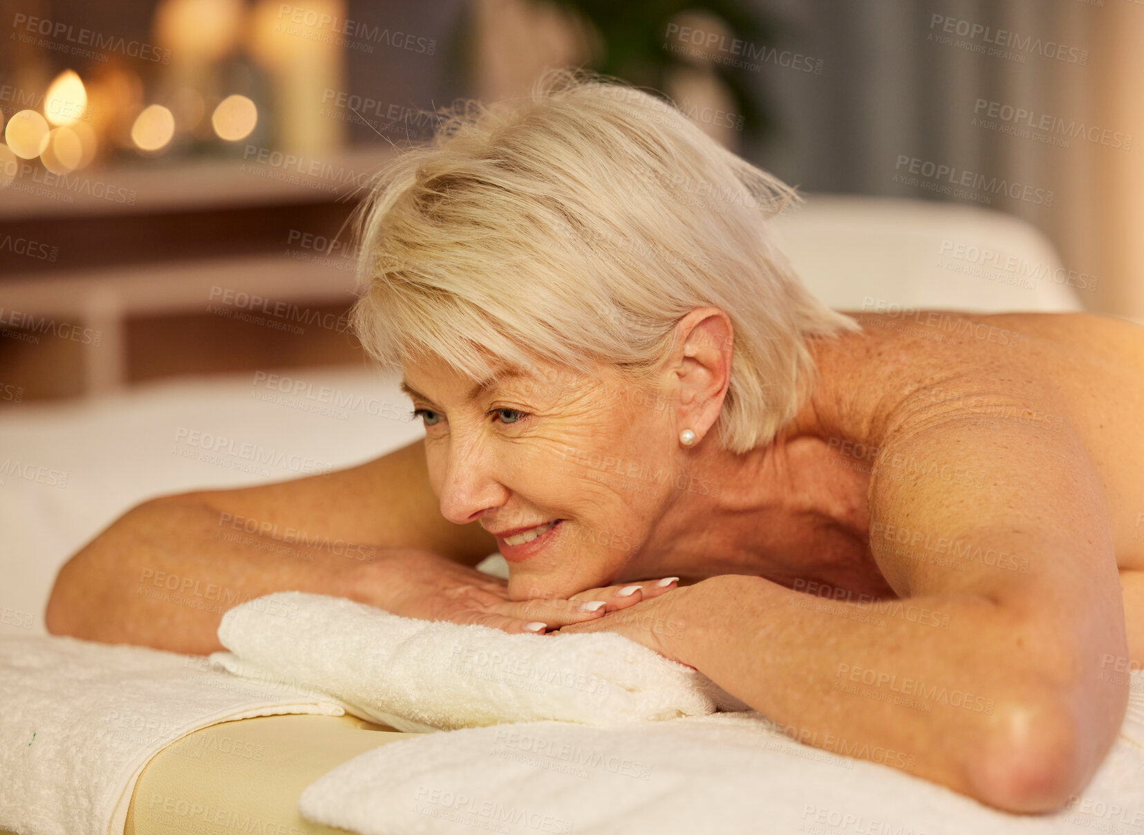 Buy stock photo Happy woman, senior and relax on spa table for skincare treatment, holistic physical therapy and healing at beauty salon. Face of customer at luxury wellness resort for massage, holiday or calm detox