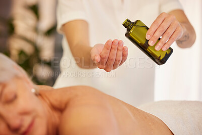 Buy stock photo Massage, oil and a therapist with a woman at a spa to relax with wellness and skincare service. Hands, bottle and a masseuse with stress relief treatment for a patient body or person at a hotel