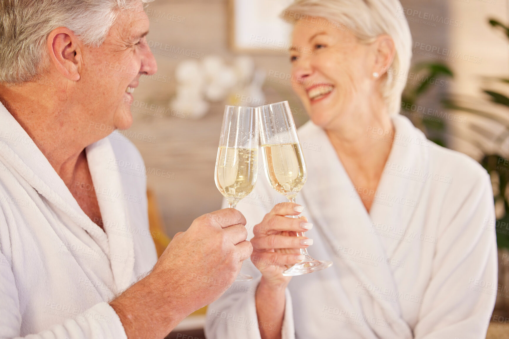 Buy stock photo Senior couple, hotel and champagne toast for romance, luxury vacation and love in retirement. Happy, holiday and elderly man and woman with a cheers, alcohol and drink together for a break or care