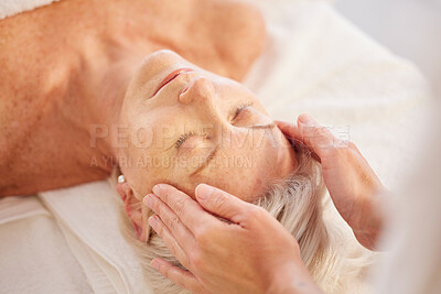 Buy stock photo Spa, head massage and senior woman at a spa for luxury, self care and facial healing treatment. Relax, wellness and elderly female person on a retirement retreat for face therapy at natural salon.