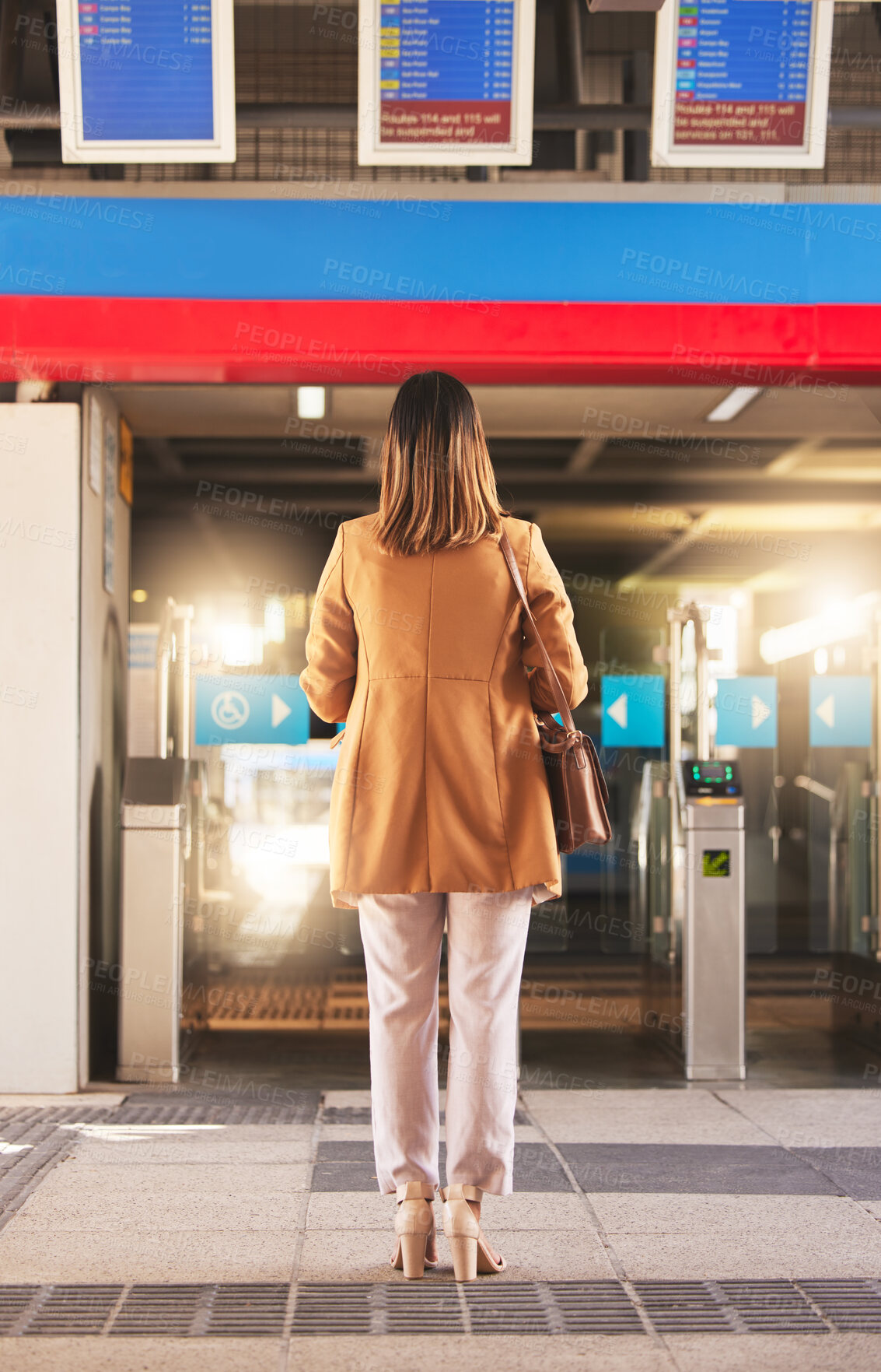 Buy stock photo Walking, back and a woman at a station for a train, travel and entrance at a platform. Standing, waiting and a person entering a subway or gate for transportation, public traveling or transit