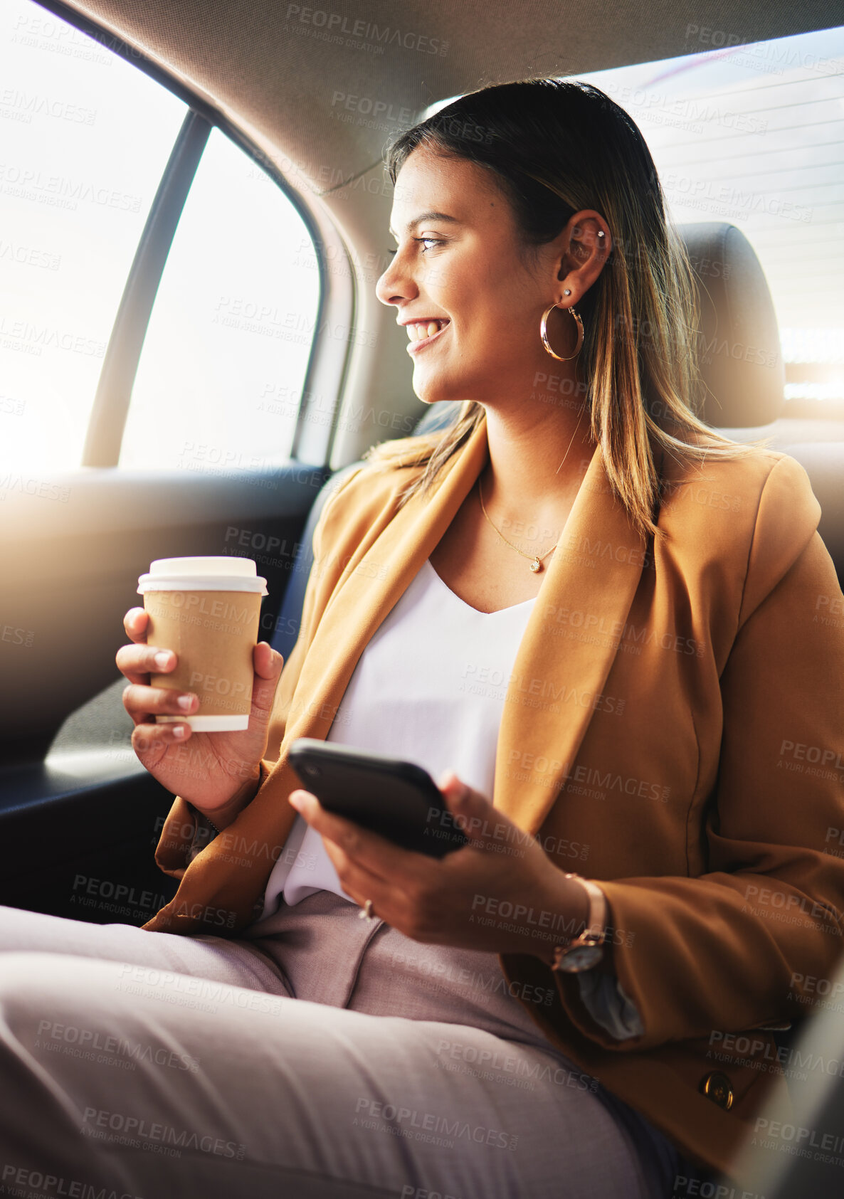 Buy stock photo Businesswoman, phone and coffee in car for travel to work with smile in happiness, alone and profile. Young, person and employee with commute to office in taxi, backseat and sitting to look at street