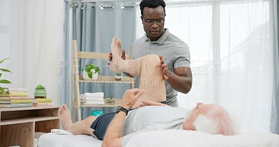 Physiotherapy, stretching legs or person with old man for rehabilitation support, recovery in motion training for knee. Physical therapy, clinic or African physiotherapist help client with mobility
