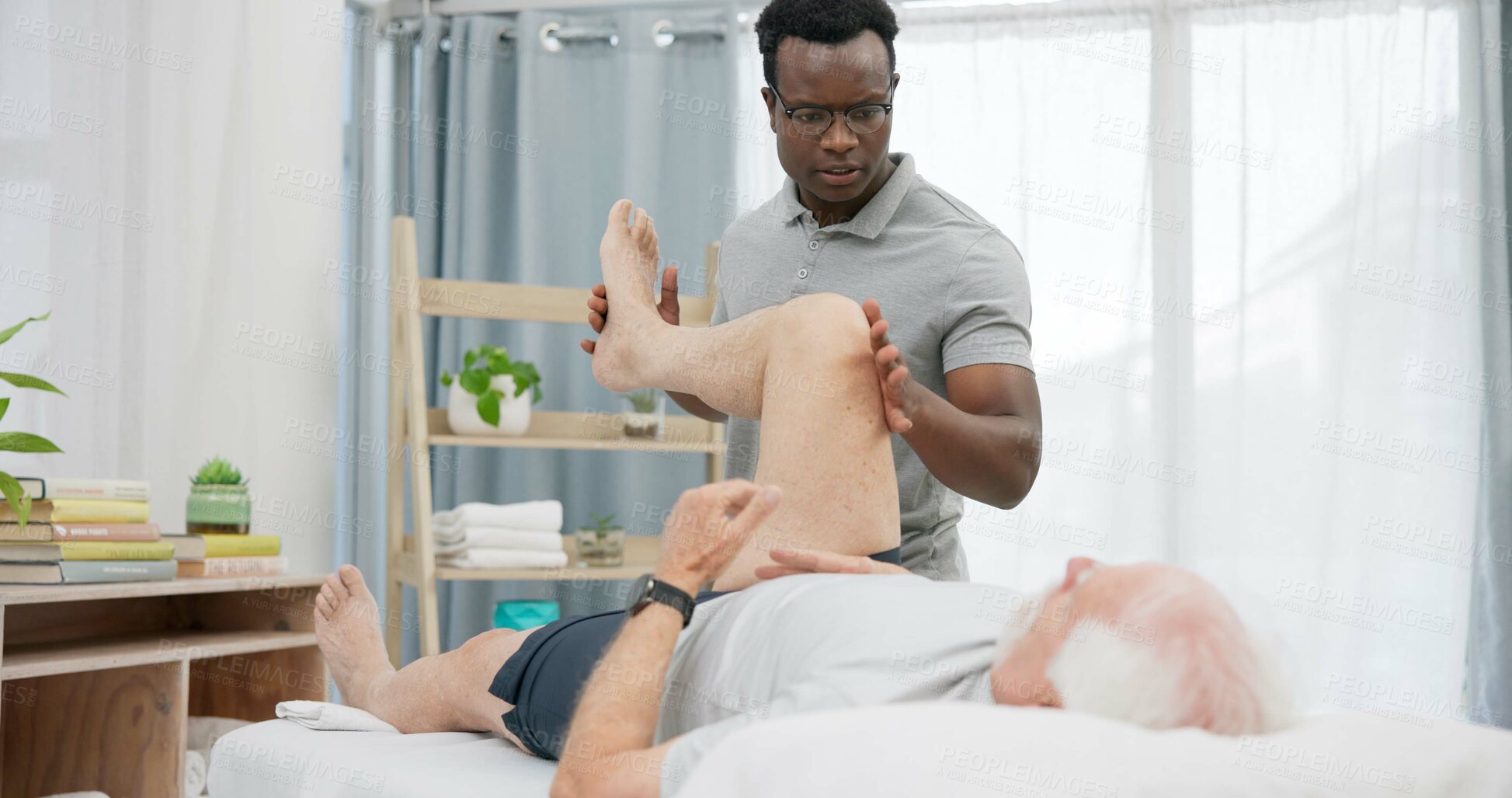 Buy stock photo Physiotherapy, stretching legs or person with old man for rehabilitation support, recovery in motion training for knee. Physical therapy, clinic or African physiotherapist help client with mobility