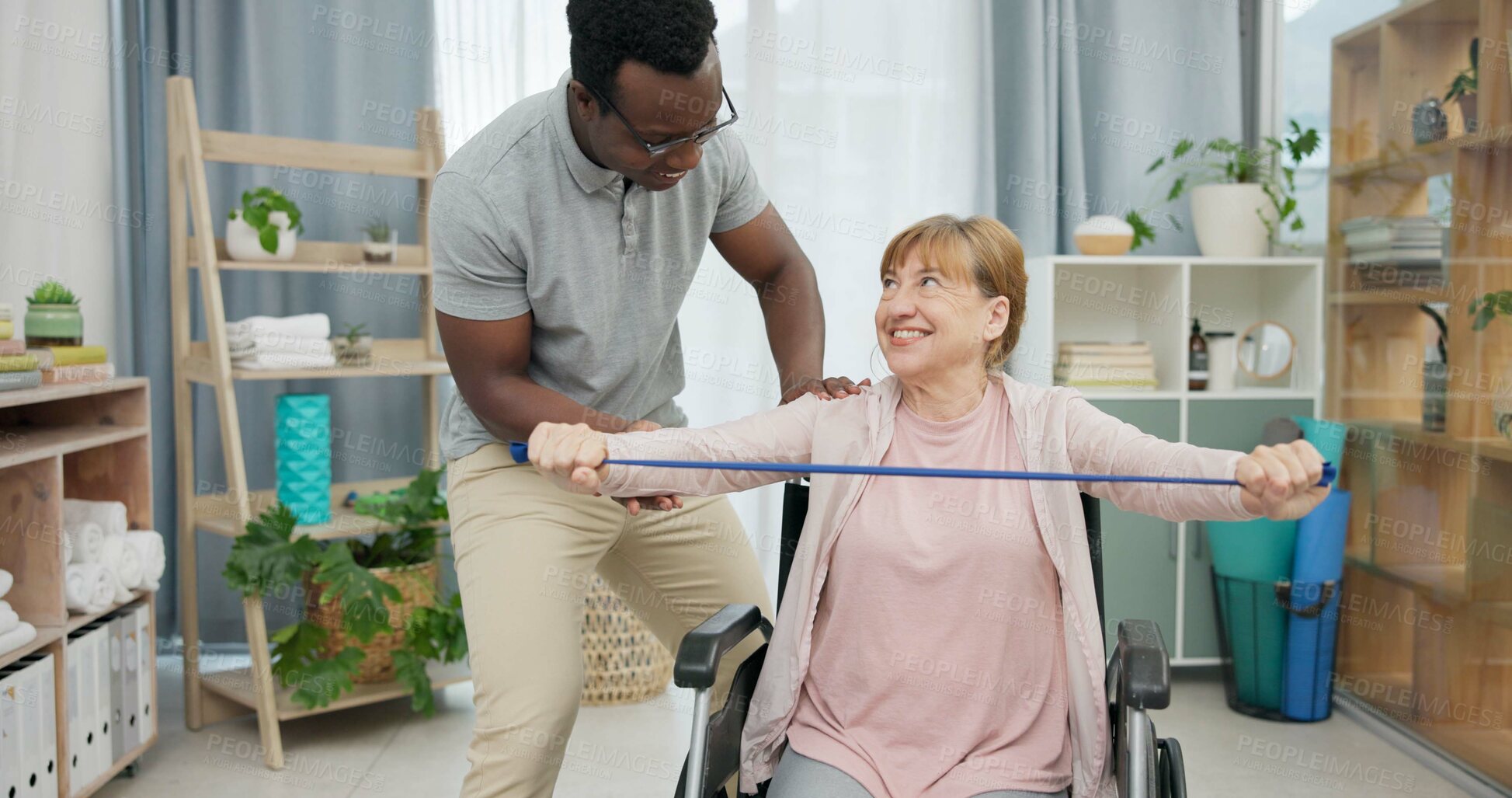 Buy stock photo Senior woman with disability, physiotherapy and stretching band for muscle rehabilitation, physical therapy and chiropractor service. Physiotherapist, medical support and happy patient in wheelchair