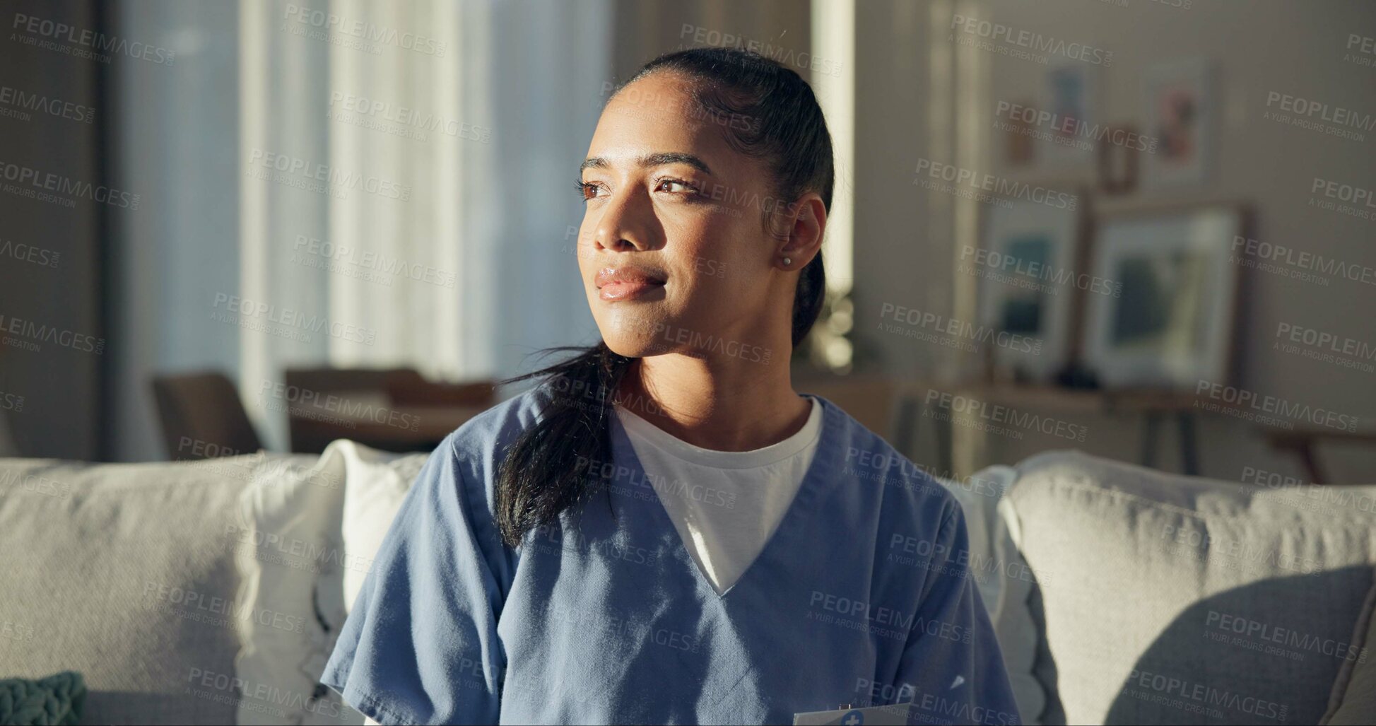 Buy stock photo Calm, thinking and a nurse or woman on the sofa to relax from a career in healthcare in a house. Smile, peace and a medical employee or doctor with an idea or vision on the couch for a memory