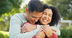 Love, smile and a married couple hugging in the garden of their home together for romance during summer. Spring, dating and smile with happy young people in the backyard while bonding in spring