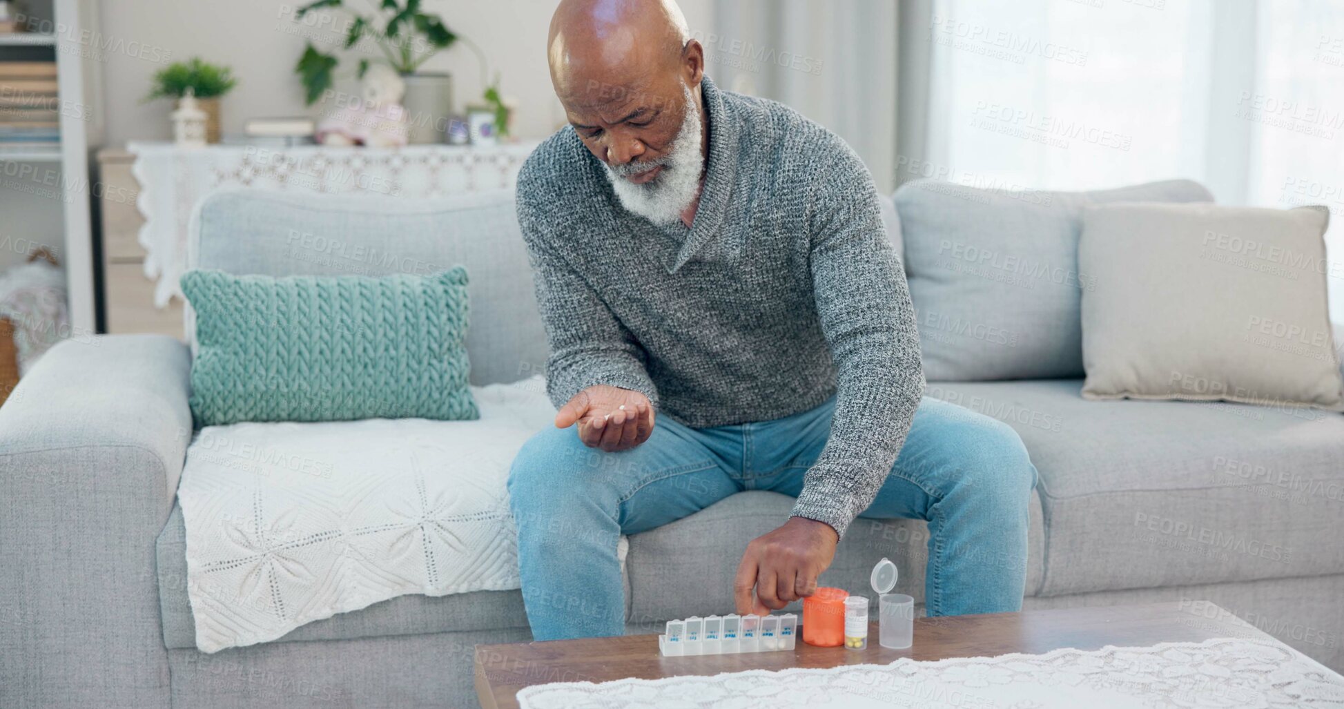Buy stock photo Container, senior black man and organise pills tablet, health medication or pharmaceutical prescription. Home sofa, medical supplement drugs and African elderly person set daily healthcare medicine