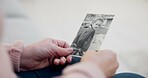 Senior woman, holding and photo with memory with hands and remembering a child in closeup. Retirement, history and elderly person with retro picture in home with nostalgia or thinking about past.