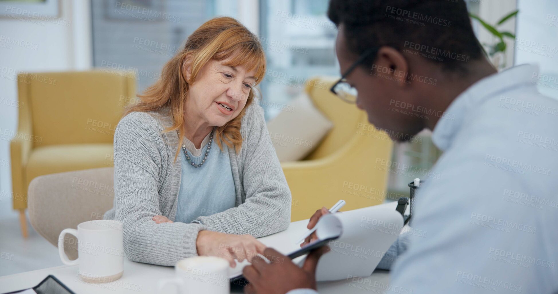 Buy stock photo Talking, results and woman with black man or doctor for healthcare, insurance or checklist. Wellness, consulting and a senior patient speaking to an African clinic worker with a document for surgery