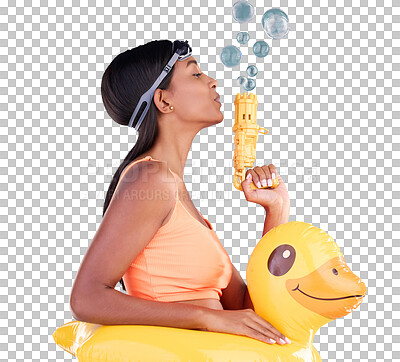 Bubbles, goggles and rubber duck with a woman on a blue background in studio ready for summer swimming. Happy, travel and vacation with an attractive or playful young female blowing a bubble gun