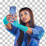 Fashion, selfie and woman with smartphone and cyberpunk neon clothing isolated on blue background. Social media, future and trendy gen z influencer from India with phone in studio for profile picture