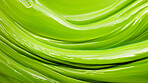 Green smooth paint texture close-up. Swirl abstract background.