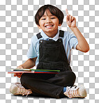 Portrait of a cute little asian boy sitting on the floor while reading against an orange background. Happy and content while focused on education, cute kid with an idea