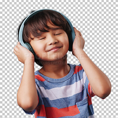 A cute young asian boy enjoying listening to music from his wireless headphones. Adorable Chinese kid smiling and feeling the magic of music while posing against an blue studio background