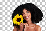 Black woman, studio portrait and sunflower with smile, beauty and cosmetic wellness by beige background. African gen z model, flower and spring aesthetic with happiness, makeup and natural makeup