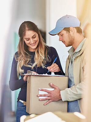 Buy stock photo Shot of a delivery man making a delivery to a happy customer at her home