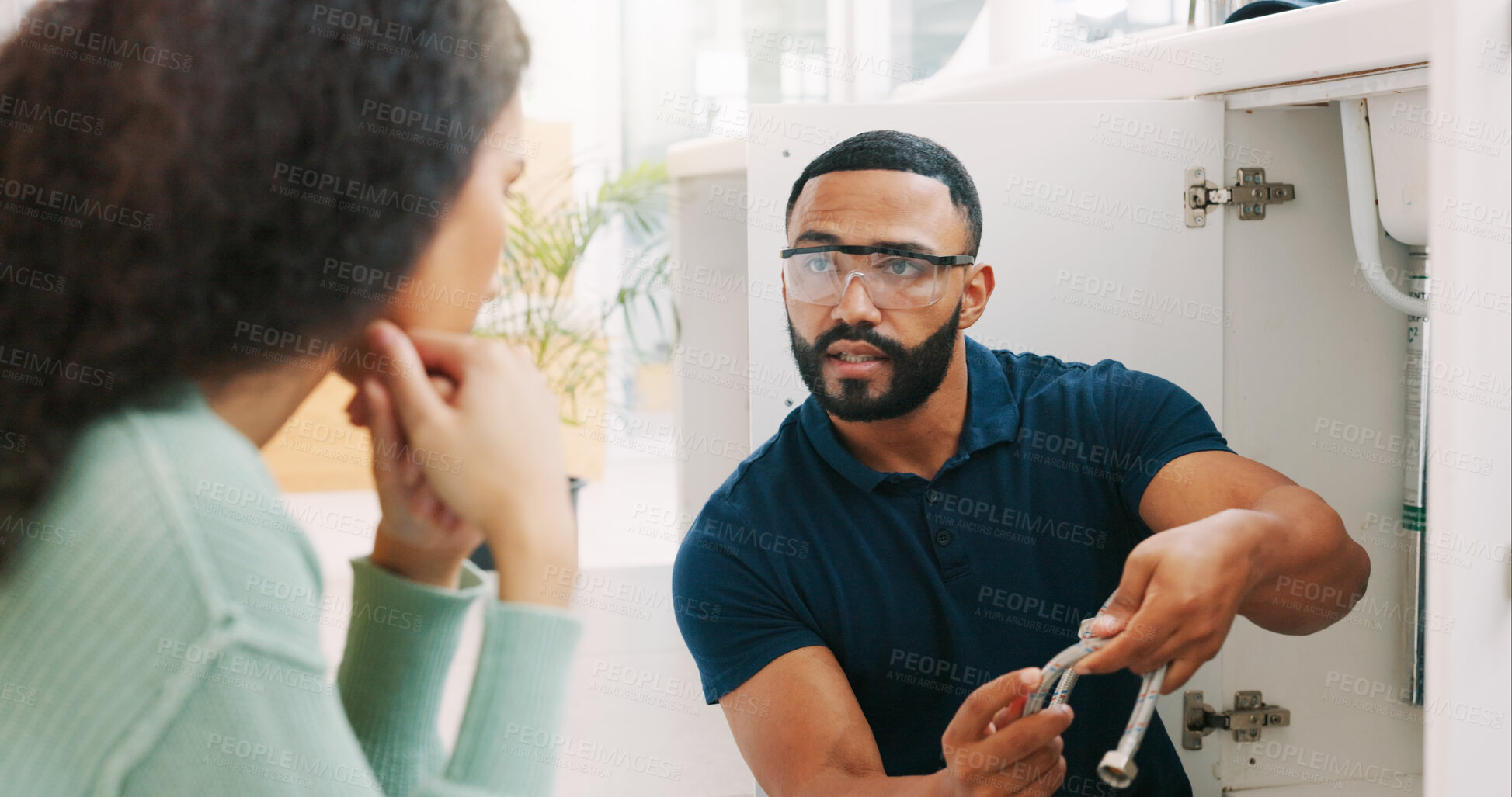 Buy stock photo Plumber black man, woman and maintenance talk in kitchen for sink pipe with customer support in home. Entrepreneur handyman, plumbing or small business owner with consulting for fixing water system