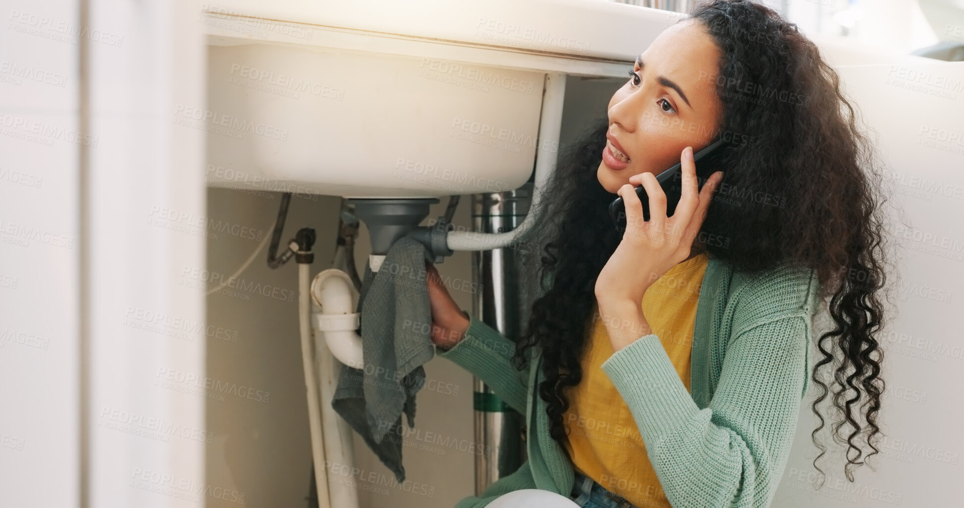 Buy stock photo Sink leak, plumbing and woman on a phone call for maintenance, plumber service and home construction. Communication, manual labour and stressed girl calling handyman for faucet, pipes or kitchen leak