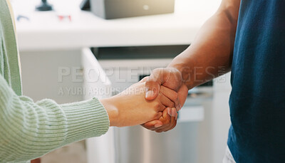 Handshake, kitchen and closeup with man, woman and agreement for plumbing services in home. Shaking hands, plumber and client with thank you for maintenance, repair and consulting in house for job