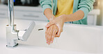 Washing hands, woman cleanse and kitchen sink of a female with soap for cleaning and wellness. Home, safety and virus protection of a person with healthcare in a house for skincare and grooming