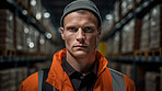 Confident serious man in warehouse. Worker, supervisor and industrial contractor at project