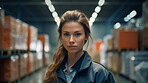 Confident serious woman in warehouse. Worker, supervisor and industrial contractor at project