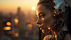 Robotic female in sunset against futuristic urban scene .