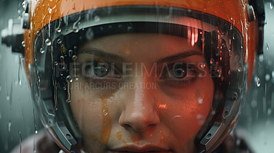 Buy stock photo Female humanlike android wearing robotic helmet in pouring rain.