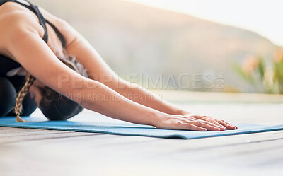 Buy stock photo Shot of an attractive young woman doing yoga outside