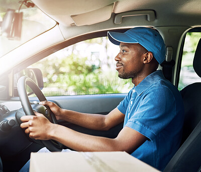 Buy stock photo Shot of a young postal working sitting in his car during a delivery