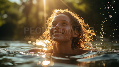 Young women swimming in lake. Warm summers day. Sun flare reflecting on water.
