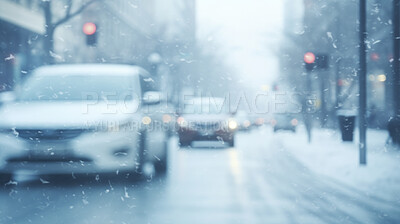 View of city road with cars or traffic in winter snowfall blizzard. Traffic in cold weather