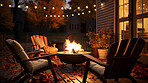 Cozy autumn patio fire with chairs. Late night by the fire pit and fairy lights in background