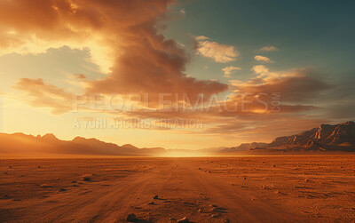 Sun rising over remote desert landscape. Cloudy, orange sky. Golden hour concept.