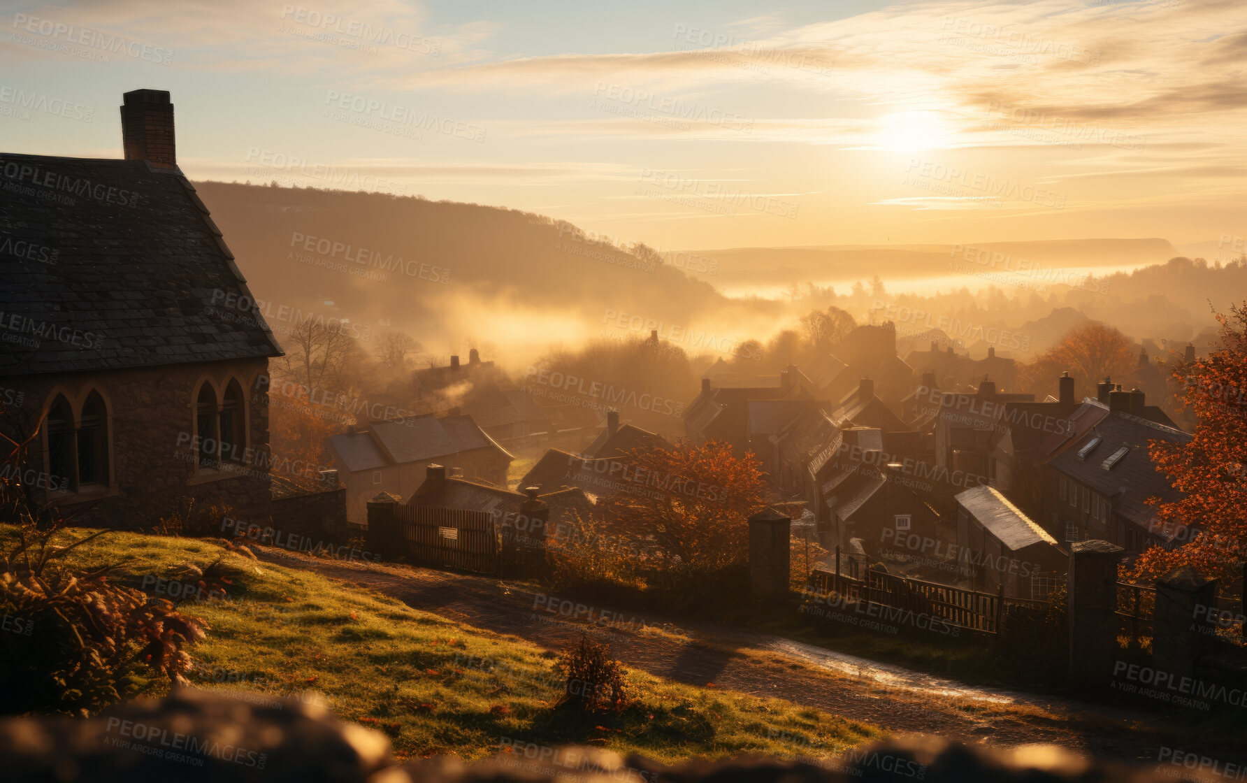 Buy stock photo Sunrising on small European town on hillside, covered in mist. Golden hour concept