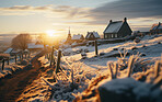 Sunrising on small European, hillside town. Covered in snow. Golden hour concept.