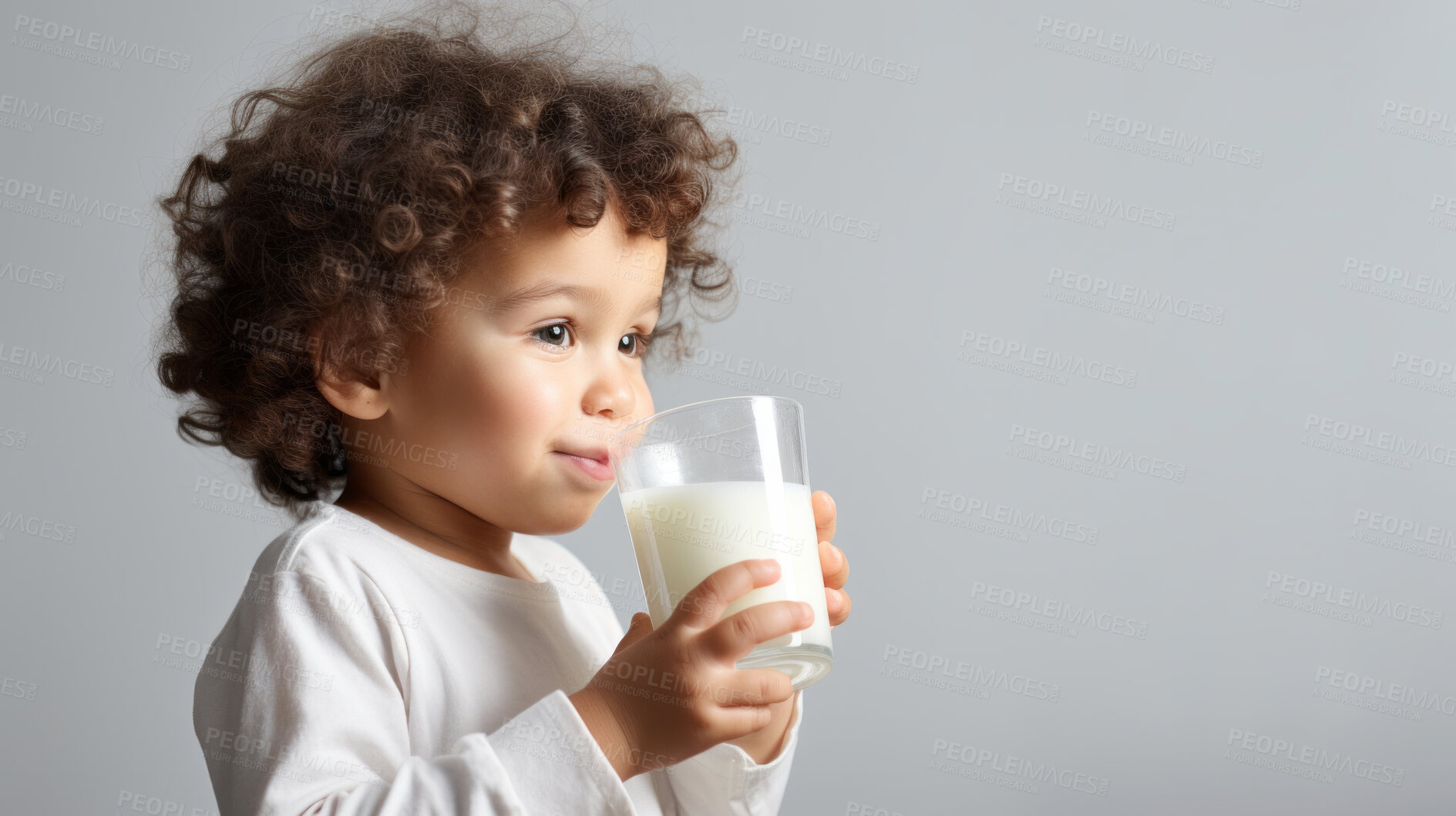 Buy stock photo Toddler holding and drinking a glass of milk. close-up of baby with a glass of milk