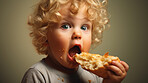 Toddler eating a piece of bread. Messy boy eating bread or snack