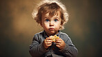 Toddler eating a piece of bread. Messy boy eating bread or snack