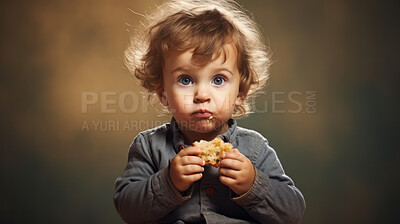 Buy stock photo Toddler eating a piece of bread. Messy boy eating bread or snack