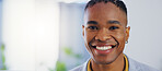 Business man, portrait and face with a smile in a corporate office while happy and confident. Closeup of a male entrepreneur person laughing with pride for professional career, motivation and goals