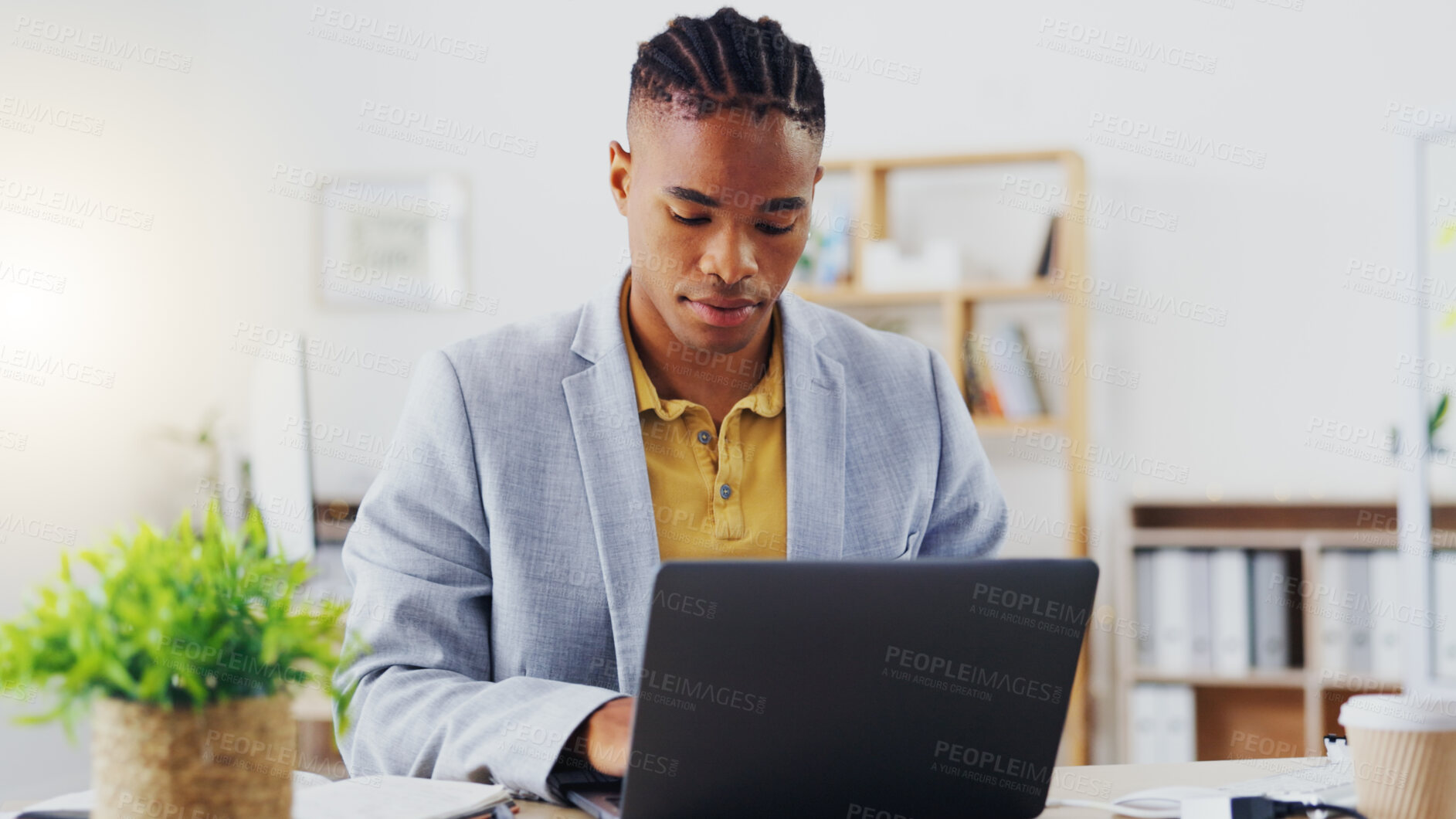 Buy stock photo Email, phone and businessman working, planning and in communication with people on the internet at work. African manager, worker or employee typing on a laptop and reading on a mobile in an office