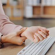 Hands, massage and woman with injury problem, carpal tunnel syndrome or ...