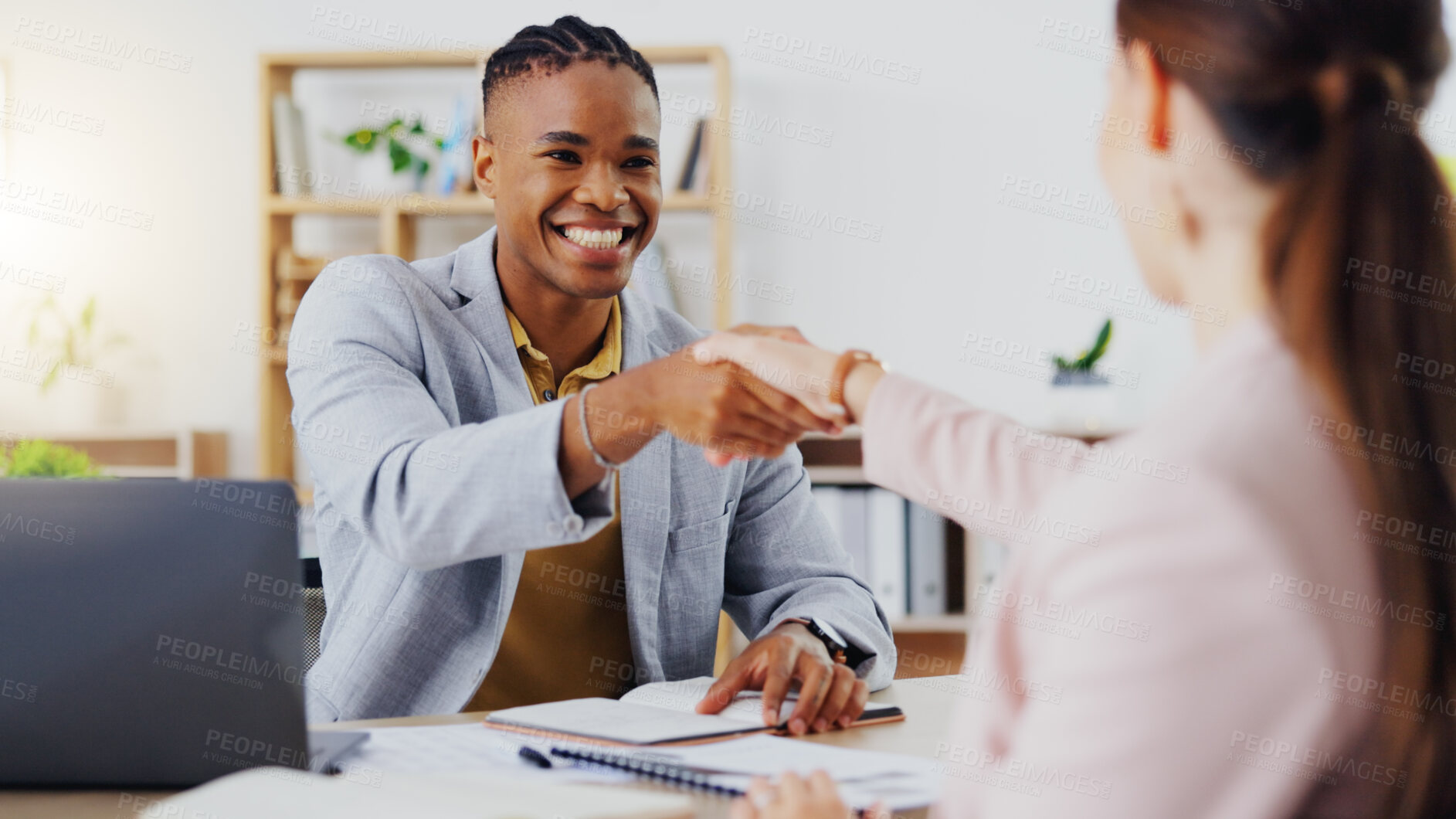 Buy stock photo Businessman, interview and handshake for hiring, partnership or agreement in recruitment at the office. Happy employer shaking hands with employee or new recruit for meeting, greeting or deal at desk