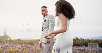 Wedding, holding hands and happy couple walking garden with love, celebration and excited future together. Field, man and woman at boho marriage reception with flowers, smile and commitment in nature