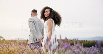 Wedding, nature and happy couple walking garden with love, celebration and excited future together. Field, man and woman at luxury marriage reception with flowers, smile and commitment holding hands.