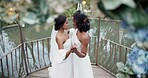 Wedding, lesbian and women dancing outdoor together at ceremony for celebration, happiness and romance. Marriage, love and lgbtq people holding hands and moving with smile in elegant dress in nature