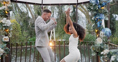 Dance, happy and a couple at a wedding with love, bonding and fun in marriage. Smile, excited and a young man and woman with celebration, moving and energy together after commitment in relationship